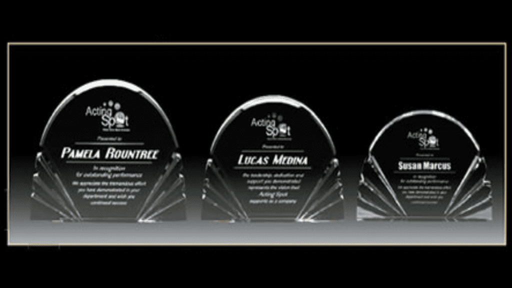 Three samples of an acrylic award in a black gradient background