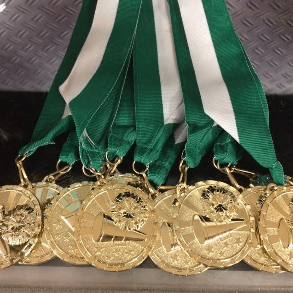 Gold medals with white and and green strap